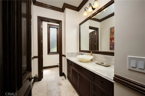 a room with a sink and a window