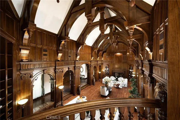 a view of a patio with couches table and chairs and potted plants