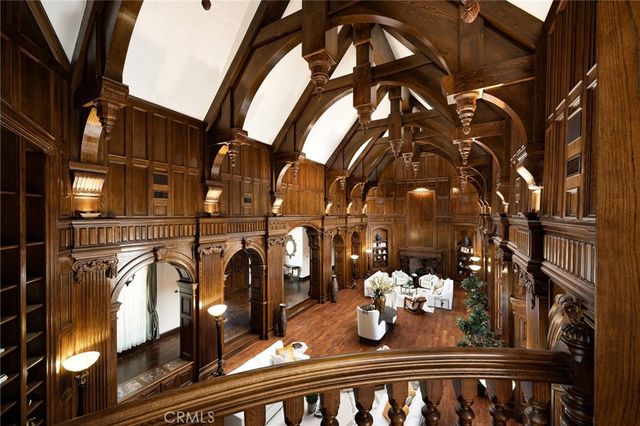 a view of a patio with couches table and chairs and potted plants