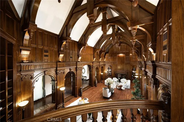 a view of a patio with couches table and chairs and potted plants
