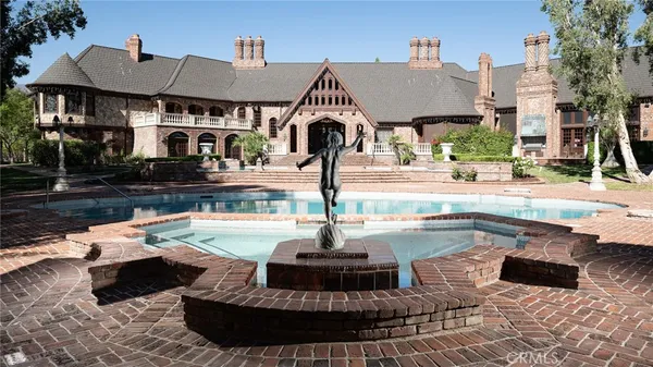 a view of a swimming pool with a patio