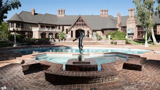 a view of a swimming pool with a patio