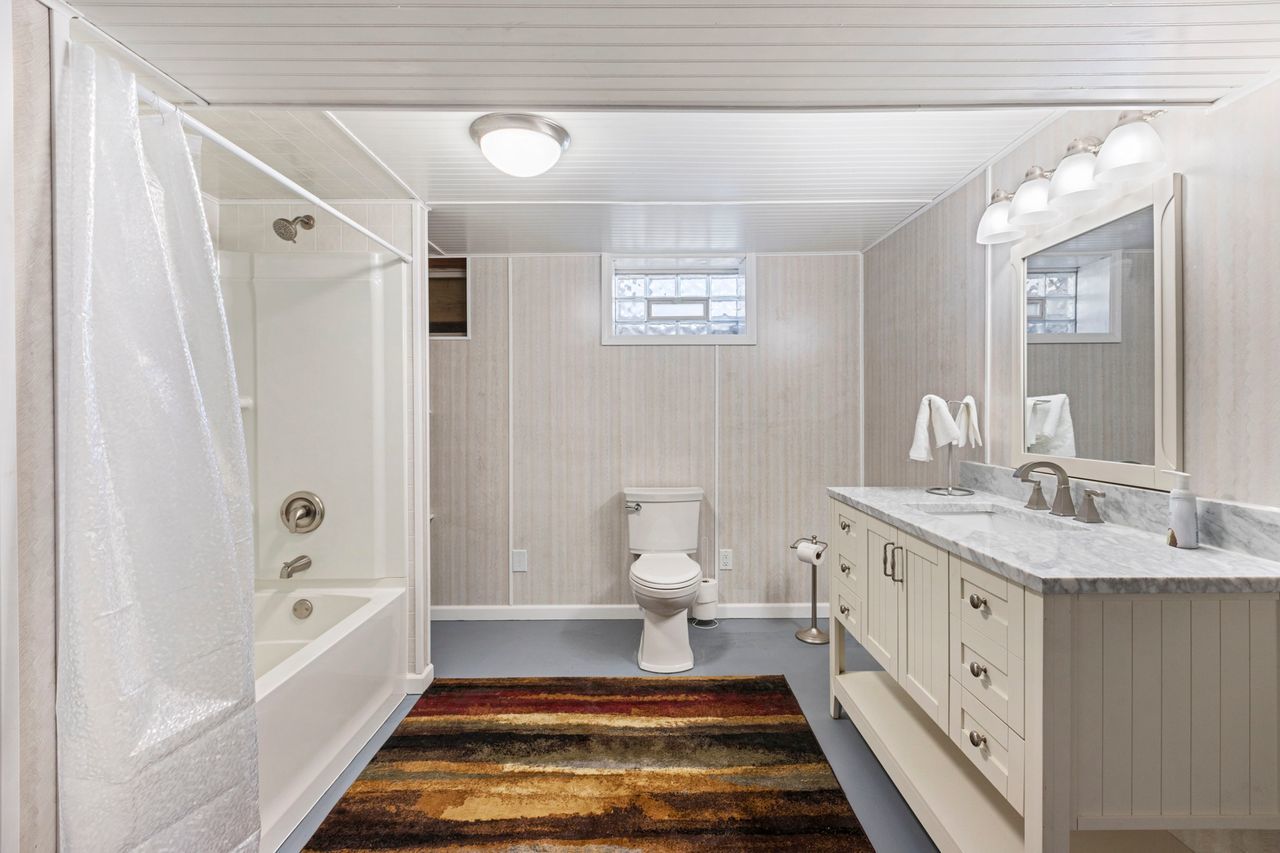 14385 Fennel Road Newark, IL 60541 - Photo 14 of 19 a spacious bathroom with a tub sink and a mirror