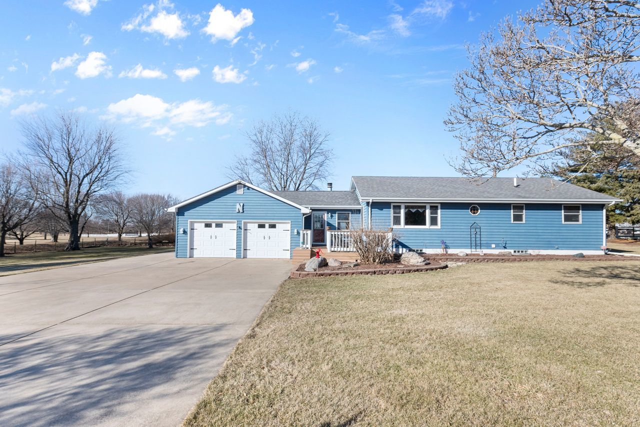 14385 Fennel Road Newark, IL 60541 - Photo 3 of 19 a front view of a house with a yard and garage