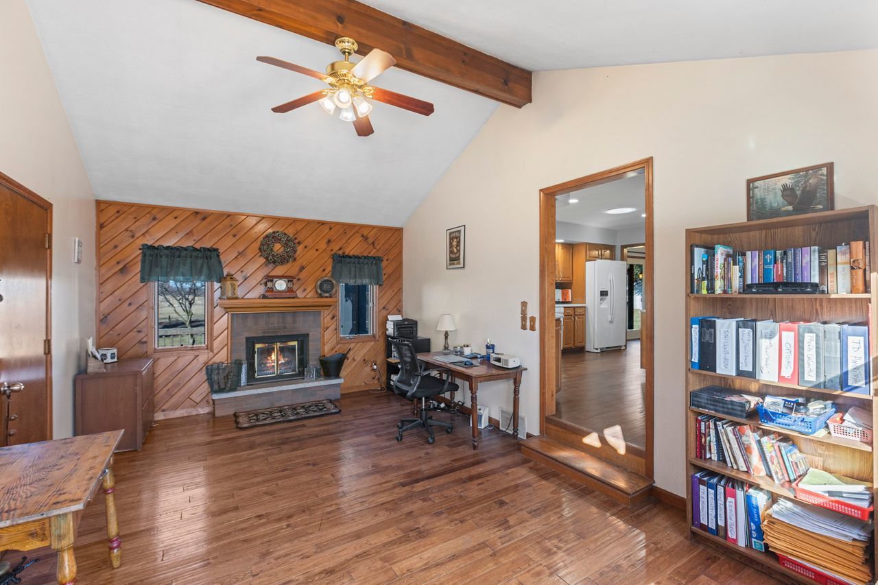 14385 Fennel Road Newark, IL 60541 - Photo 4 of 19 a living room with furniture a flat screen tv and a fireplace