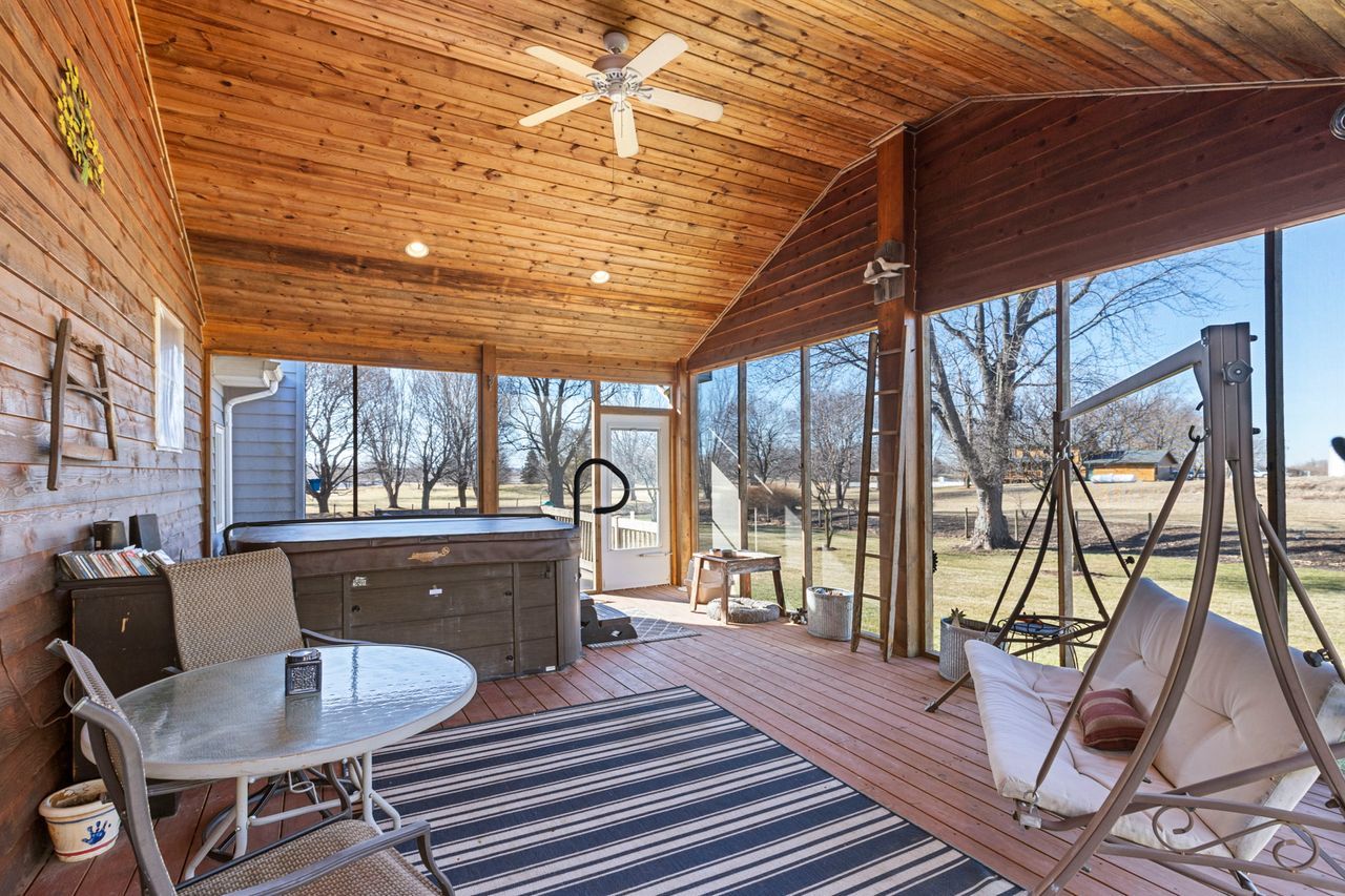 14385 Fennel Road Newark, IL 60541 - Photo 7 of 19 a dining room with wooden floor and large windows