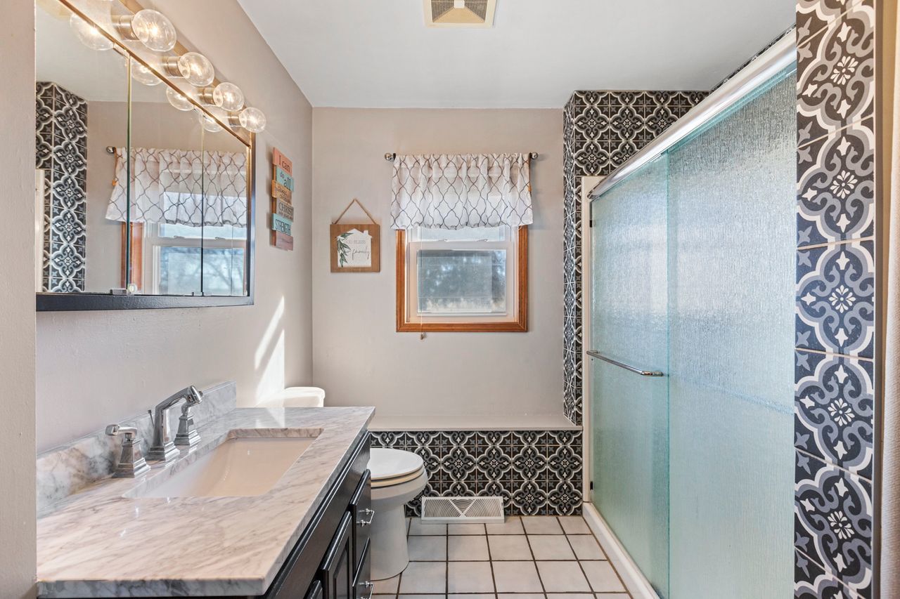 14385 Fennel Road Newark, IL 60541 - Photo 10 of 19 a bathroom with a sink a toilet and a mirror