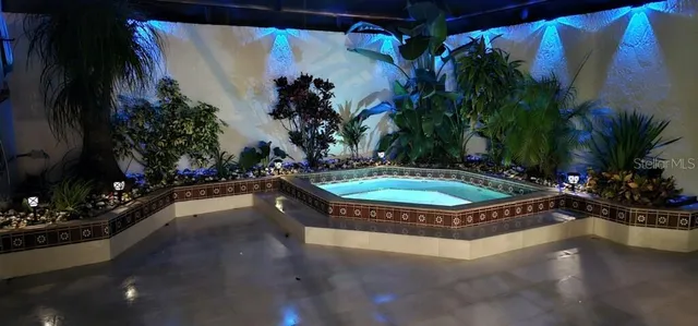 a view of a swimming pool with a yard