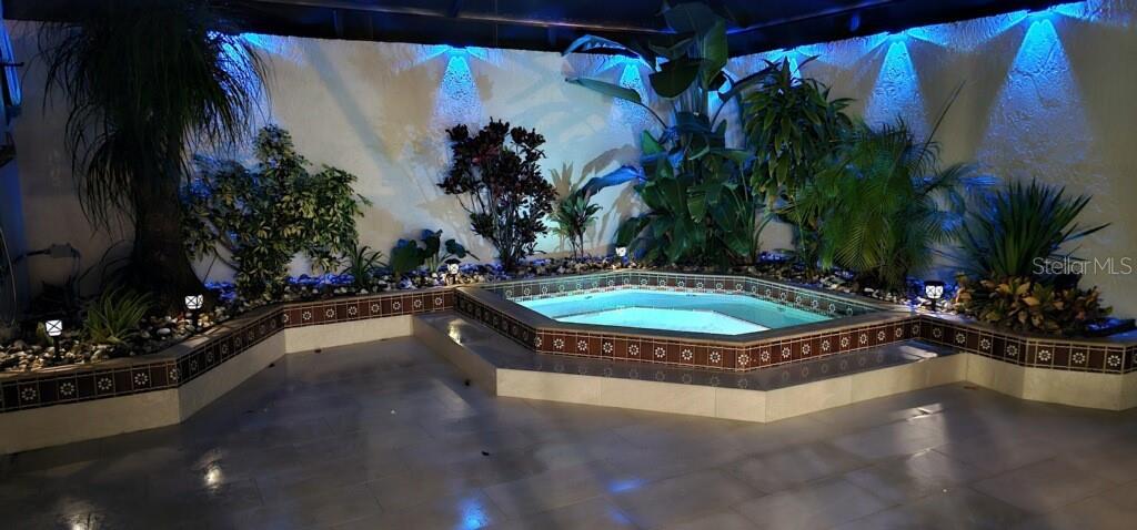 1932 Maple Circle, Unit 1932 Tavares, FL 32778 - Photo 22 of 39 a view of a swimming pool with a yard