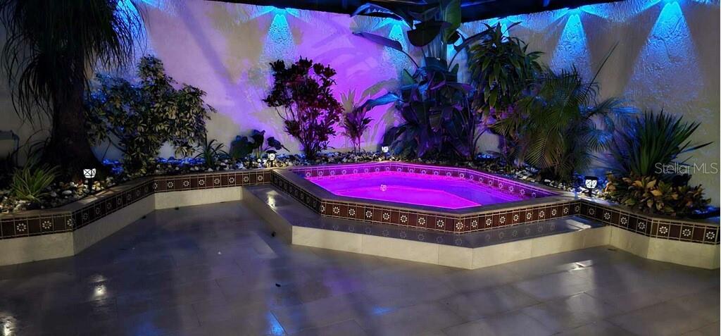 1932 Maple Circle, Unit 1932 Tavares, FL 32778 - Photo 24 of 39 a view of a swimming pool with red chairs