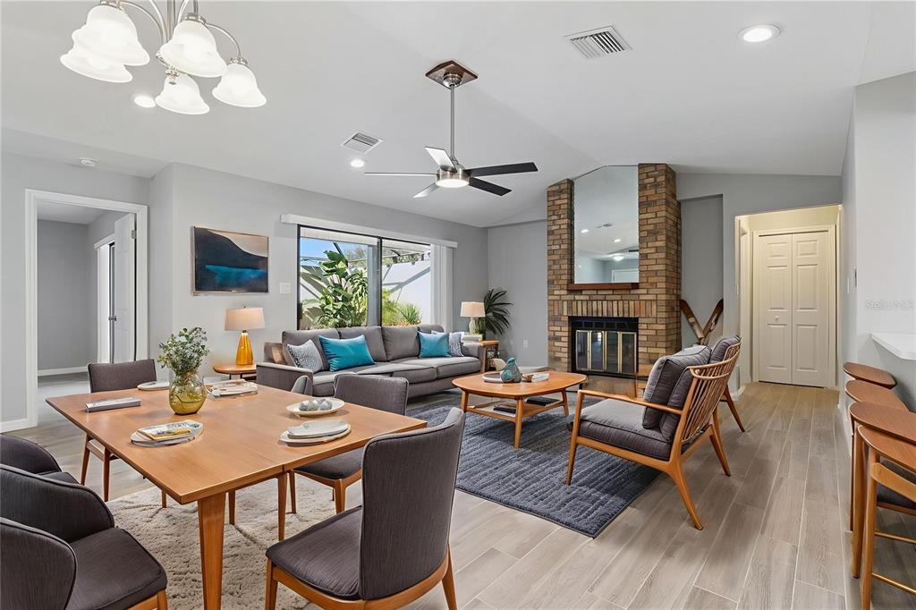 1932 Maple Circle, Unit 1932 Tavares, FL 32778 - Photo 5 of 39 a living room with fireplace furniture and a wooden floor