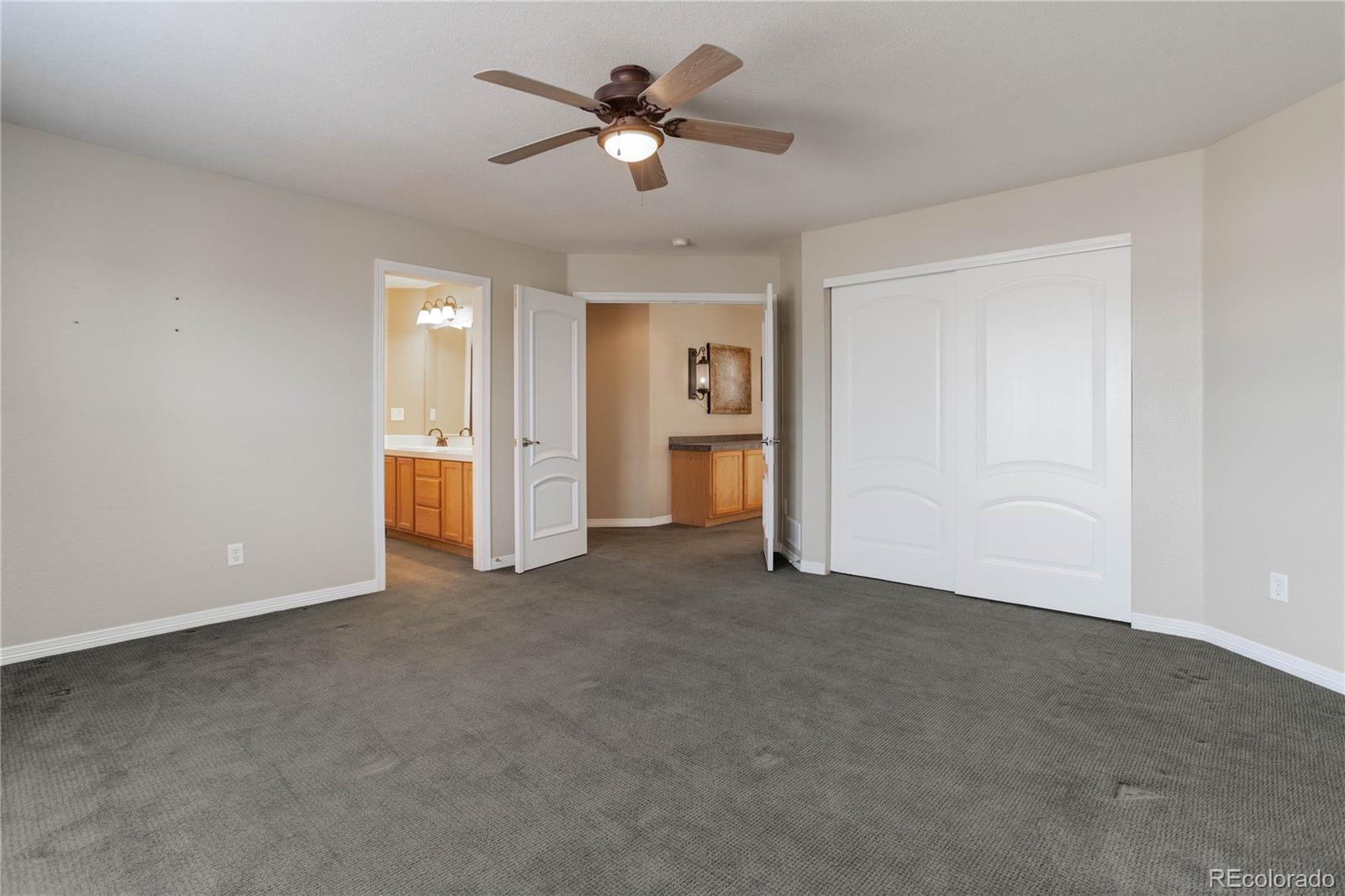 2720 Rockbridge Way Highlands Ranch, CO 80129 - Photo 28 of 39 a view of a big room with chandelier fan and a livingroom