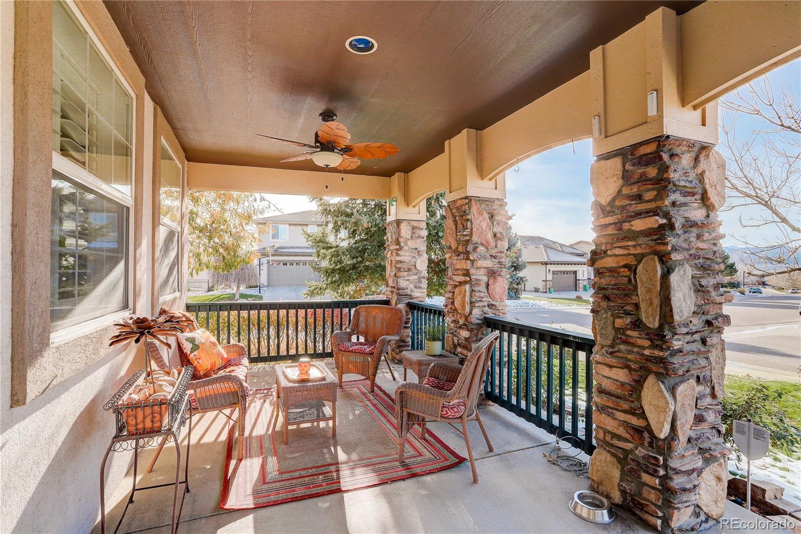 2720 Rockbridge Way Highlands Ranch, CO 80129 - Photo 3 of 39 a view of a chairs and table in the balcony