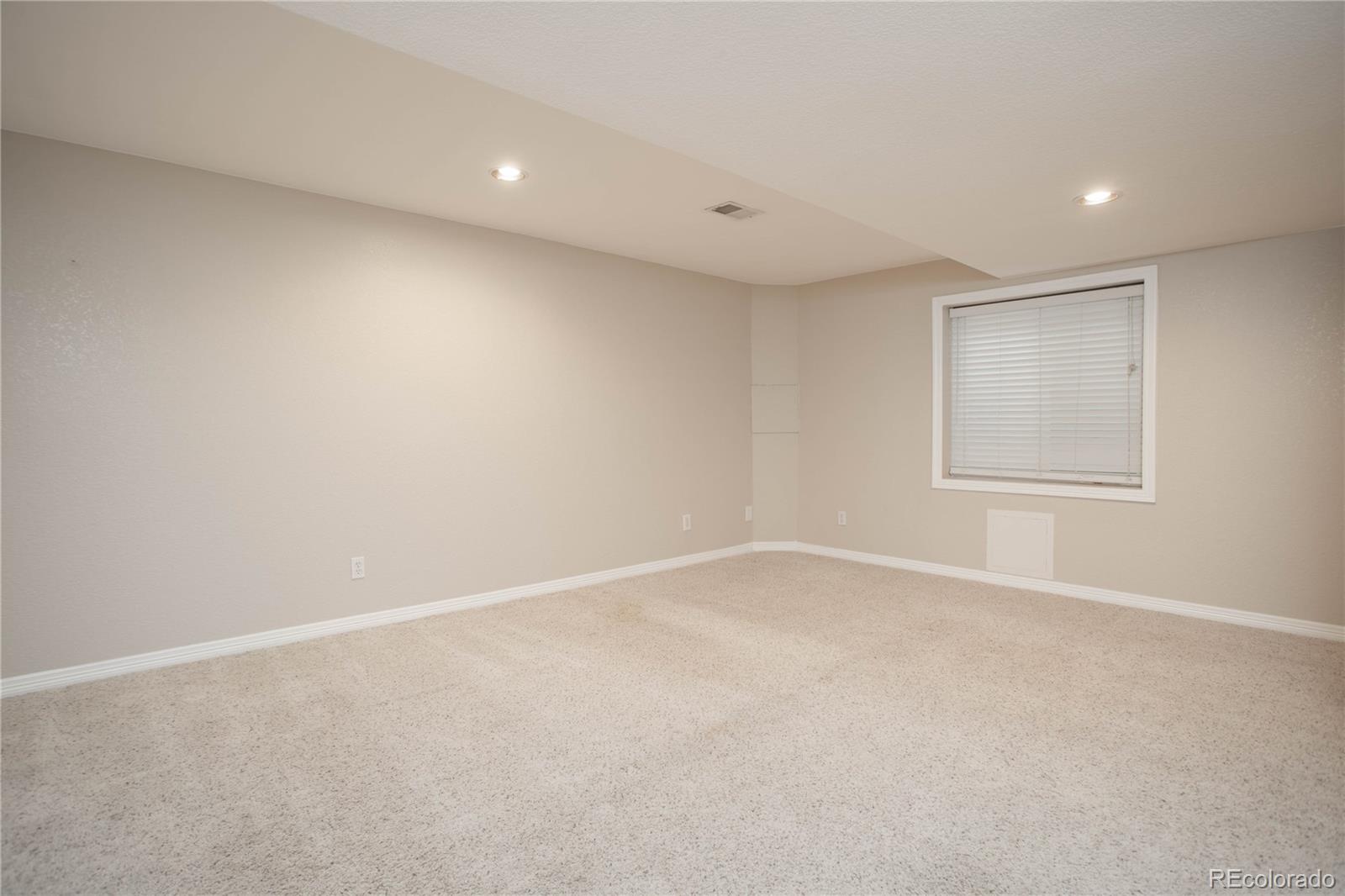 2720 Rockbridge Way Highlands Ranch, CO 80129 - Photo 35 of 39 a view of an empty room with a window