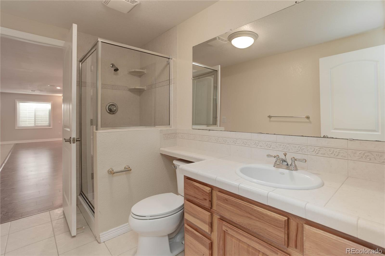 2720 Rockbridge Way Highlands Ranch, CO 80129 - Photo 36 of 39 a bathroom with a sink toilet and shower
