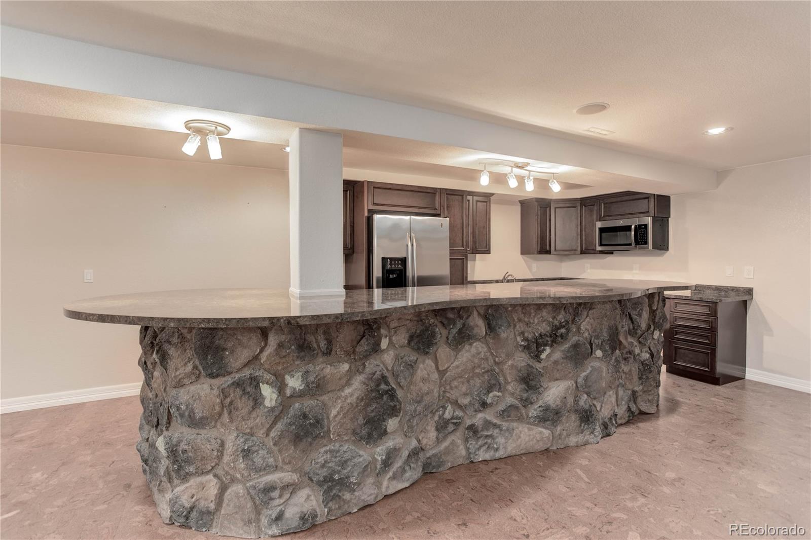 2720 Rockbridge Way Highlands Ranch, CO 80129 - Photo 38 of 39 a bathroom with a sink and mirror