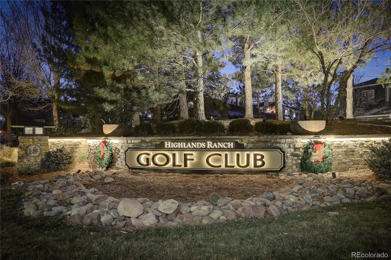 2720 Rockbridge Way Highlands Ranch, CO 80129 - Photo 39 of 39 a front view of a house with a garden and trees