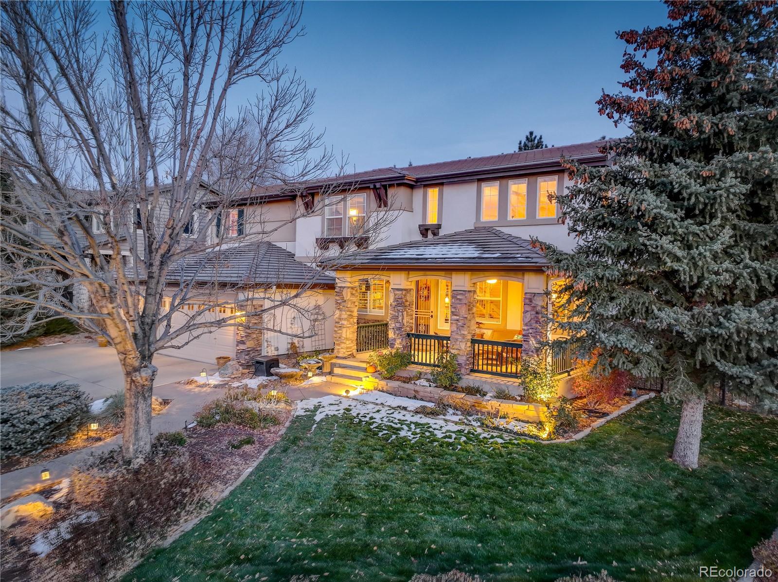 2720 Rockbridge Way Highlands Ranch, CO 80129 - Photo 4 of 39 a view of a house with a yard
