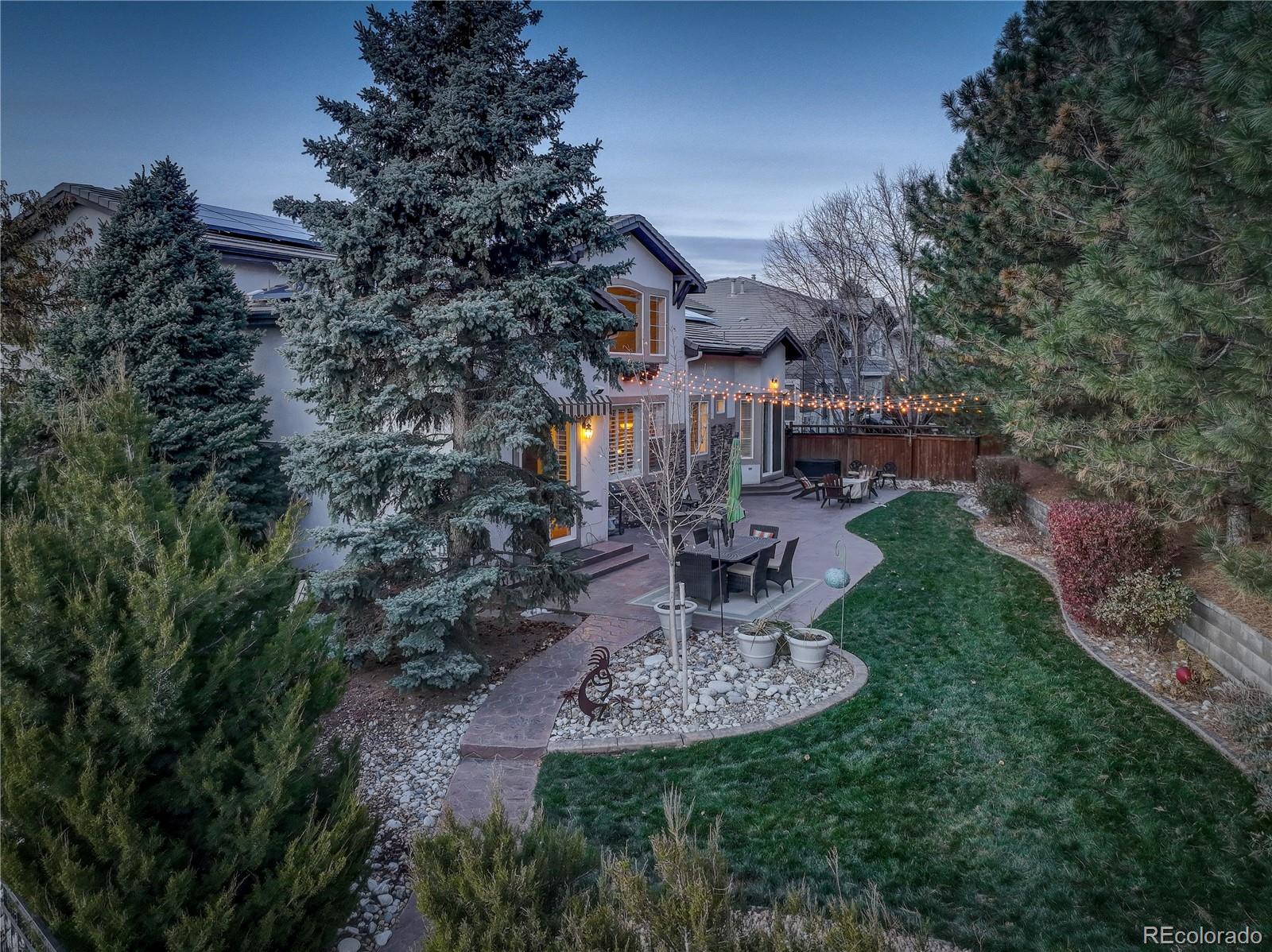 2720 Rockbridge Way Highlands Ranch, CO 80129 - Photo 5 of 39 a view of a house with a yard porch and sitting area