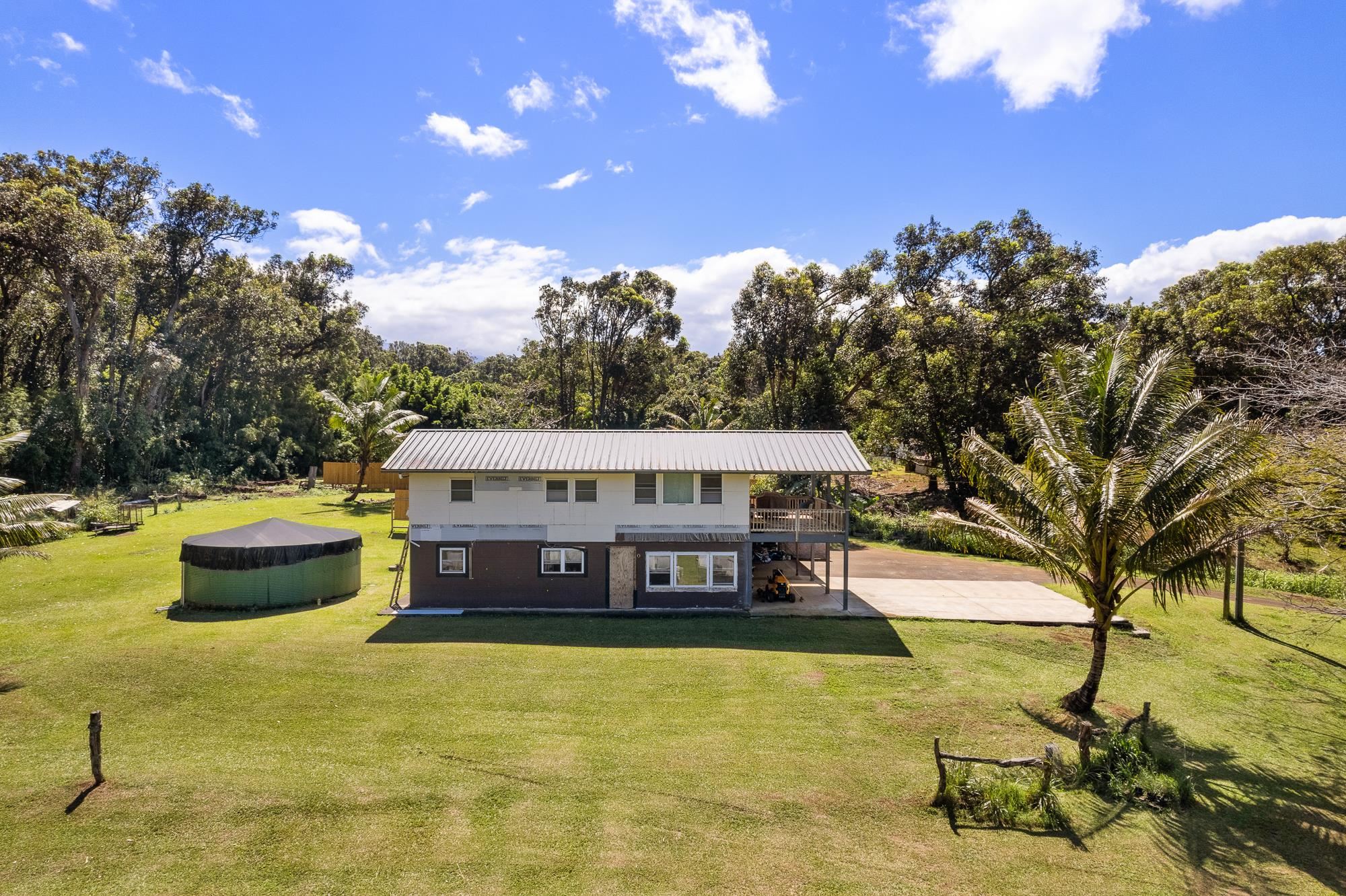 a view of a swimming pool with an outdoor seating and a yard