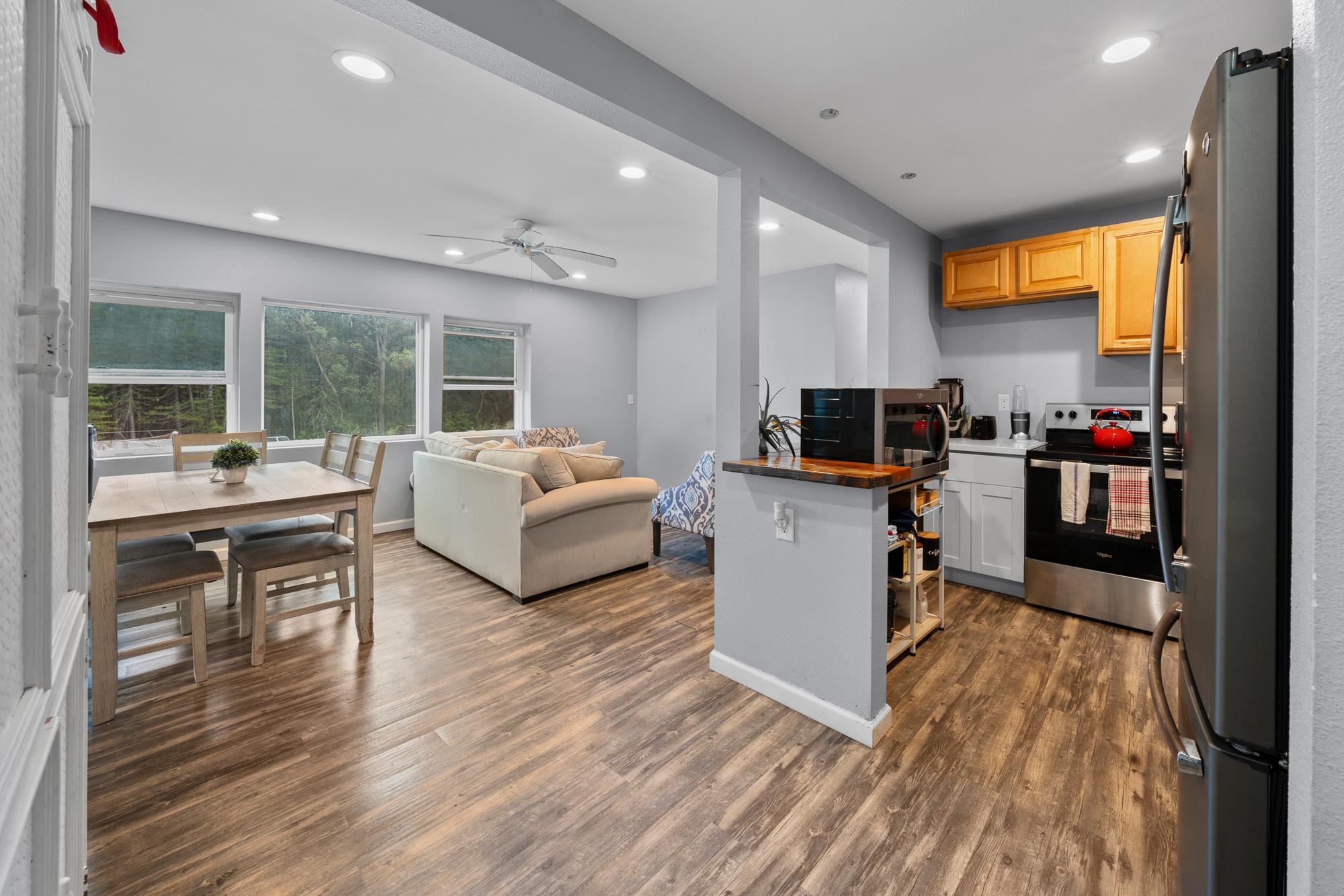 685 Upper Ulumalu Road Haiku, HI 96708 - Photo 11 of 34 a living room with furniture and a flat screen tv