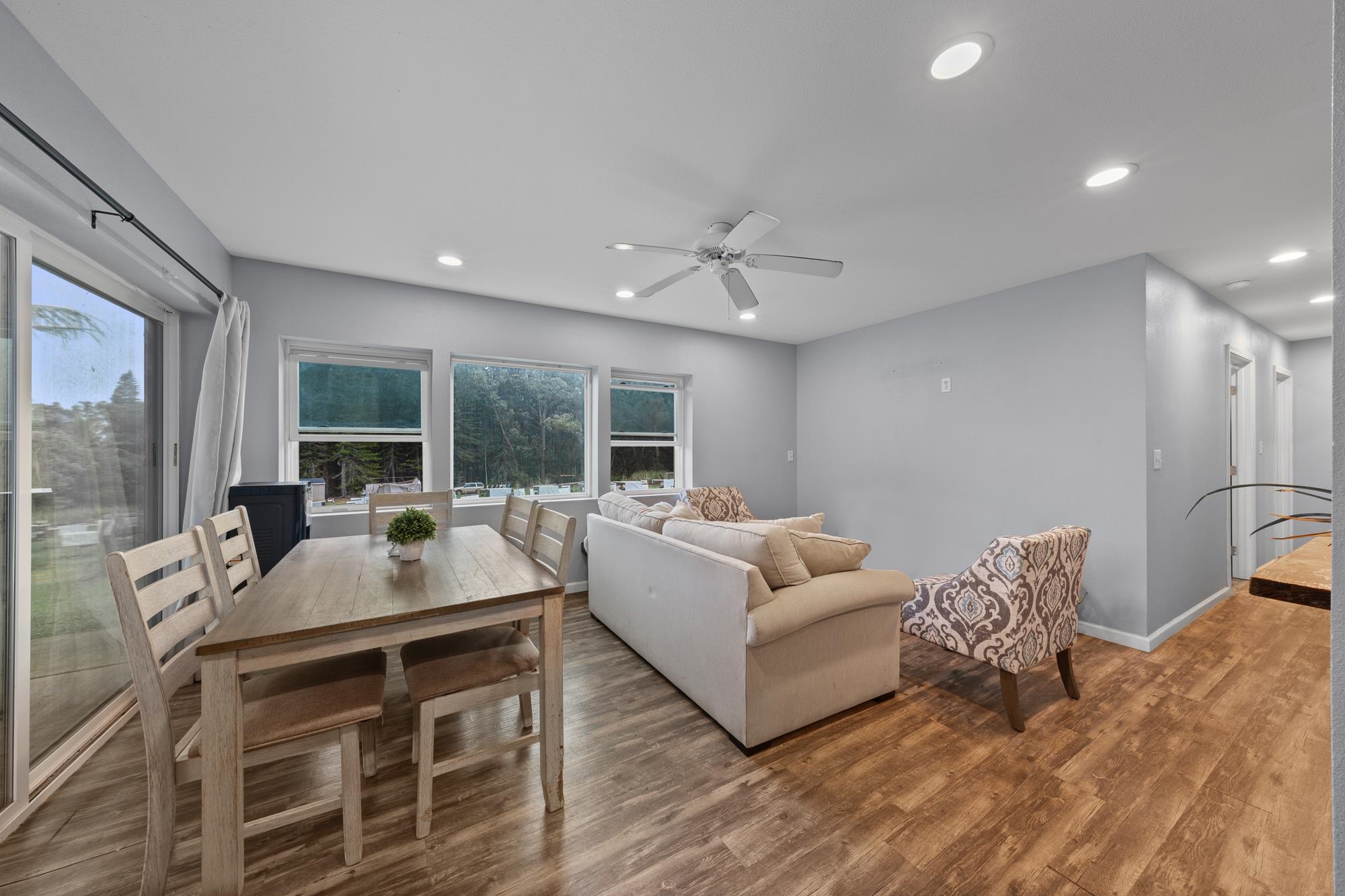 685 Upper Ulumalu Road Haiku, HI 96708 - Photo 12 of 34 a living room with furniture and a large window