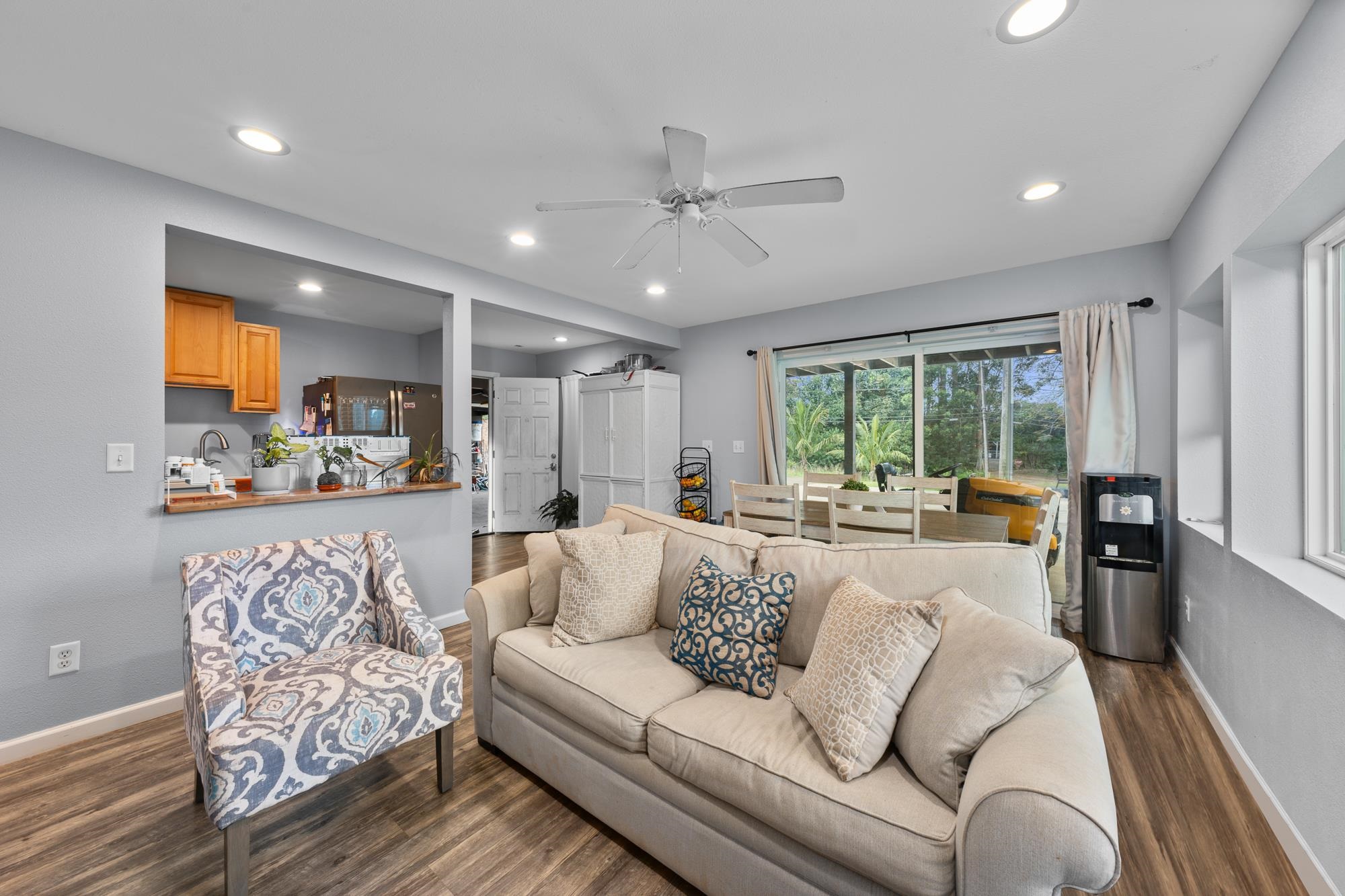 685 Upper Ulumalu Road Haiku, HI 96708 - Photo 13 of 34 a living room with furniture and a large window