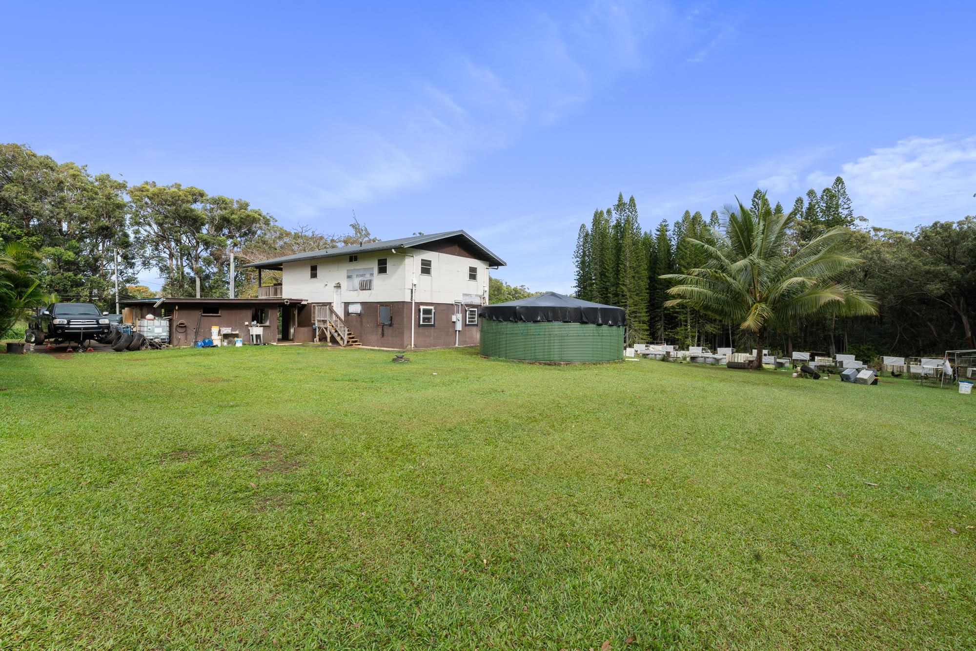 685 Upper Ulumalu Road Haiku, HI 96708 - Photo 33 of 34 a view of a house with a big yard