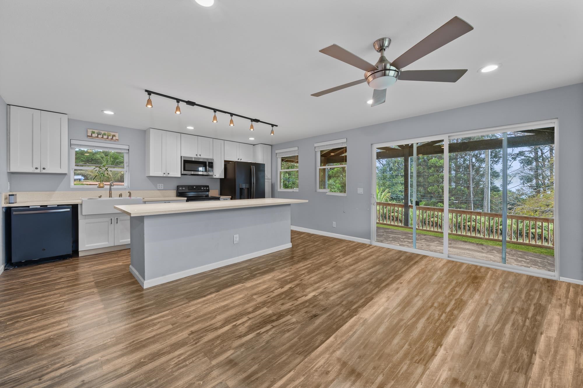 685 Upper Ulumalu Road Haiku, HI 96708 - Photo 5 of 34 a large kitchen with stainless steel appliances kitchen island a large counter top and sink