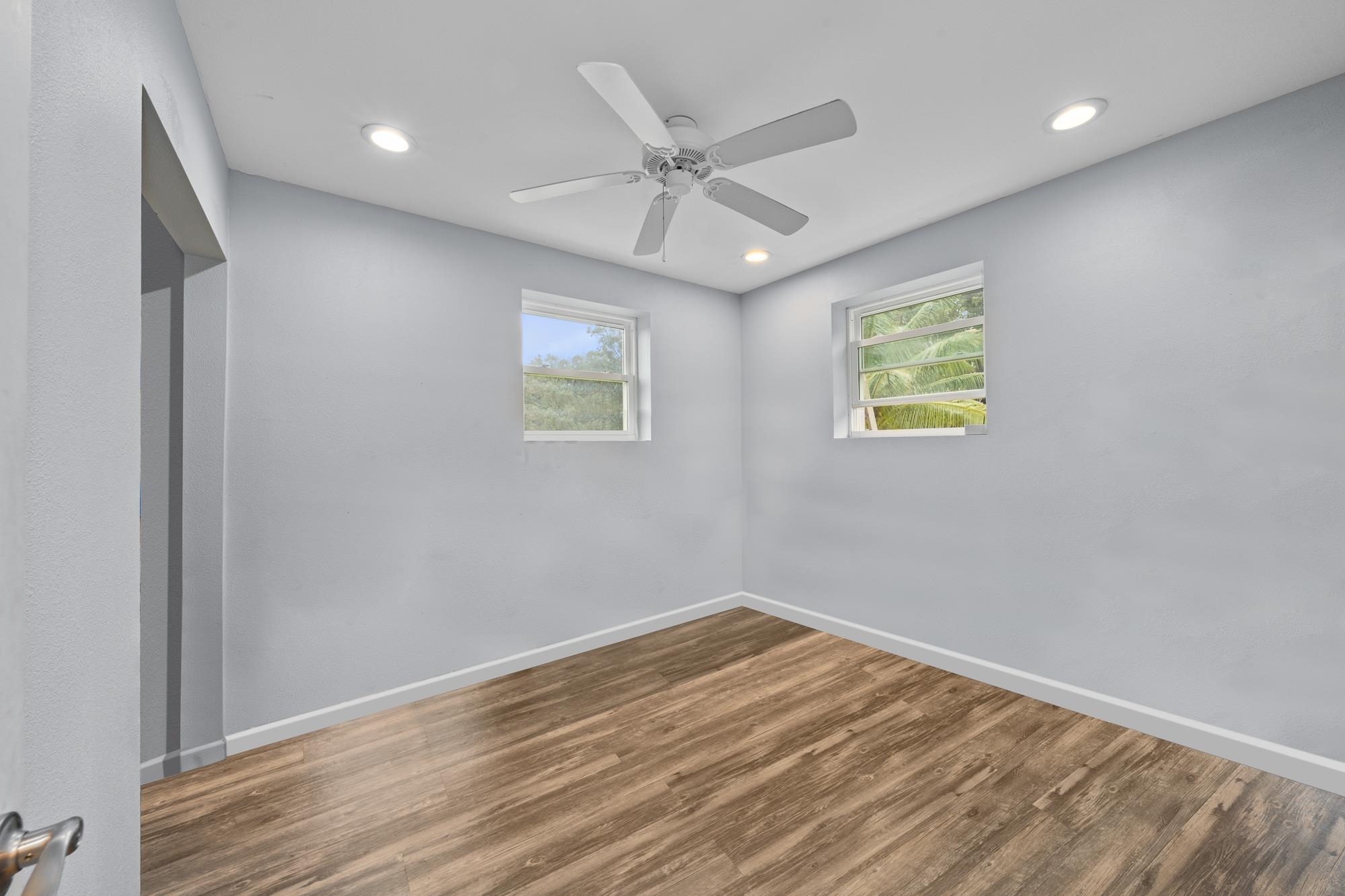 685 Upper Ulumalu Road Haiku, HI 96708 - Photo 7 of 34 a view of an empty room with a window and wooden floor