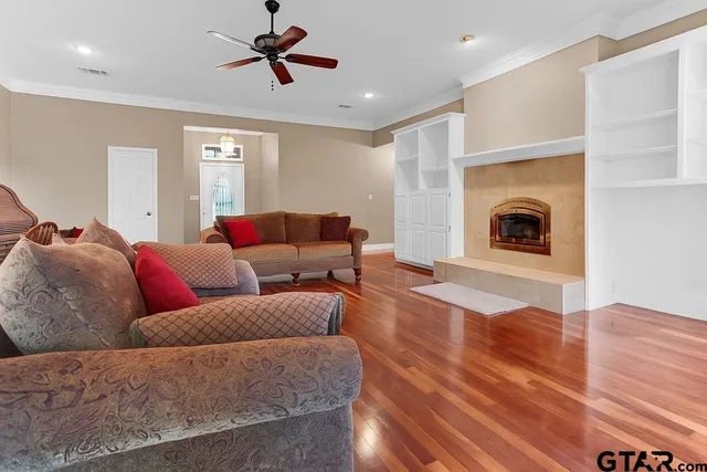 a living room with furniture and a fireplace