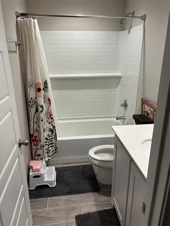 a bedroom with bed and window
