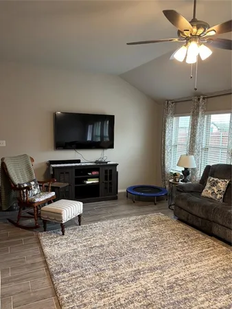 a kitchen with stainless steel appliances granite countertop a sink stove refrigerator and cabinets