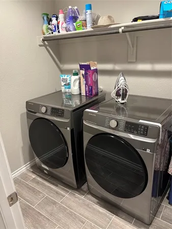 a bedroom with a bed a dresser and a window