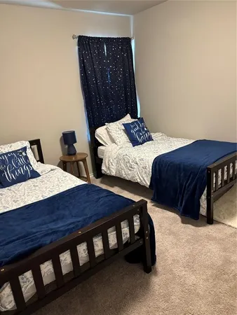 a bedroom with a bed and window