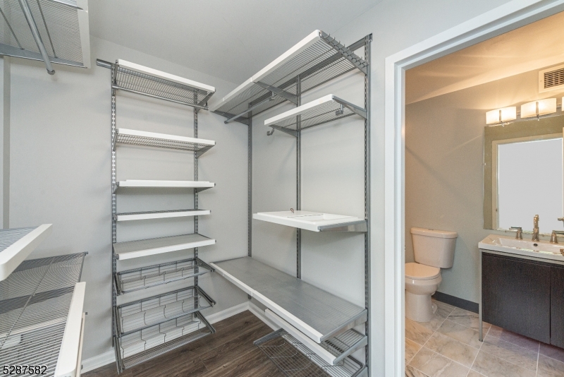 240 Main Street, Unit 313 Little Falls, NJ 07424 - Photo 13 of 21 a bathroom with a toilet sink and a shower