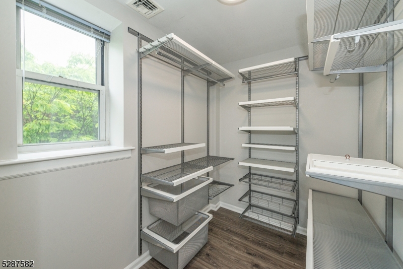 240 Main Street, Unit 313 Little Falls, NJ 07424 - Photo 14 of 21 a room with wooden floor and windows