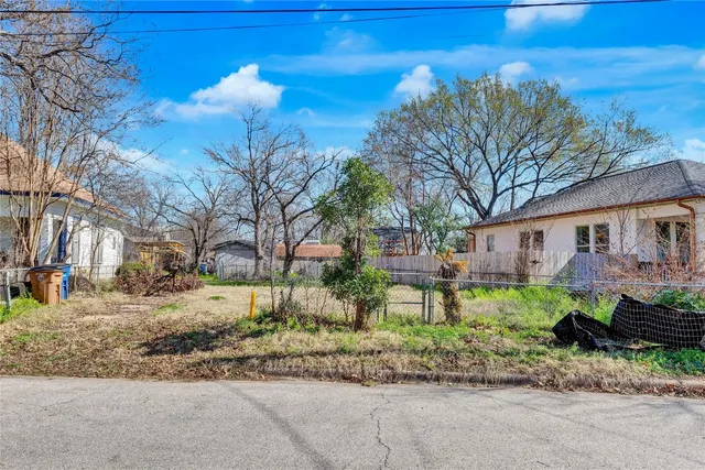 a house that has a tree in front of it