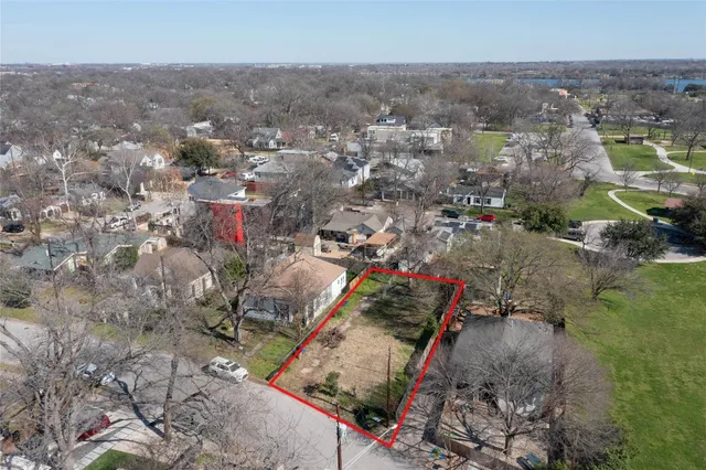 an aerial view of a houses with outdoor space