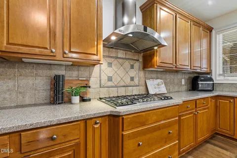 a kitchen with granite countertop cabinets and outdoor space