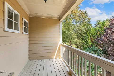 a view of a balcony with wooden floor