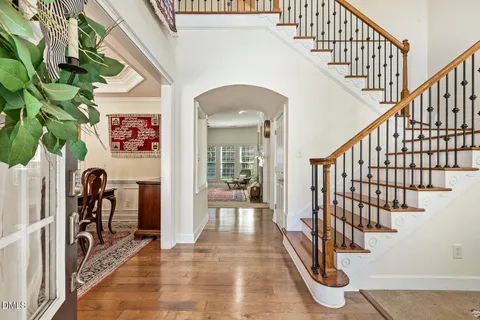 a view of entryway with wooden floor and a rug