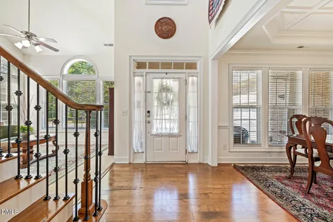 a view of an entryway with wooden floor