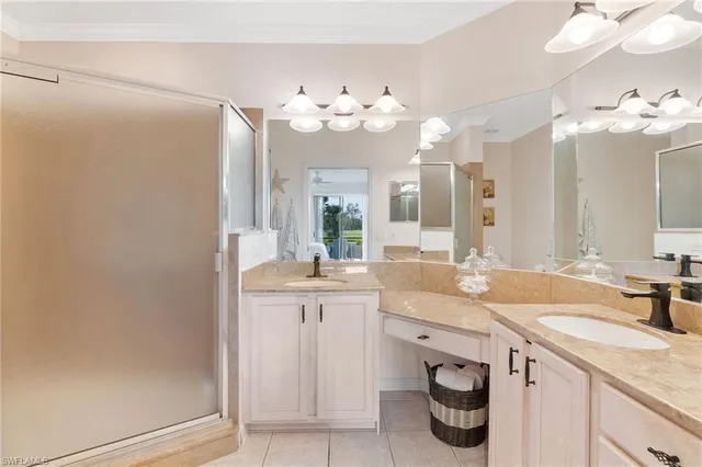 a bathroom with a sink vanity and a mirror