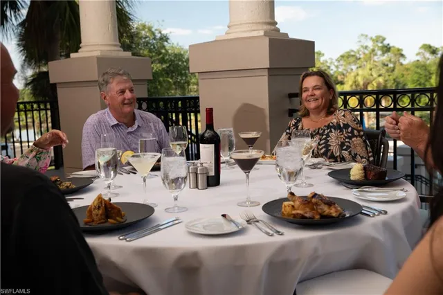 a view of a dining room and hall with furniture