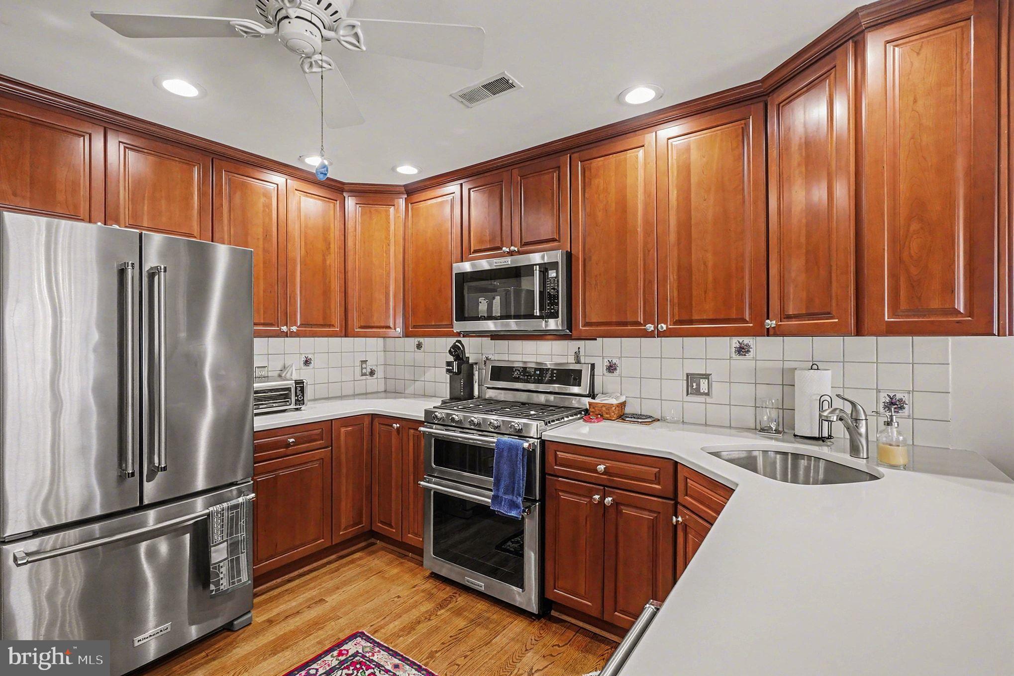 202 Pointe Way, Unit 202B Havre de Grace, MD 21078 - Photo 14 of 72 a kitchen with stainless steel appliances granite countertop a refrigerator a sink dishwasher a stove top oven a refrigerator and cabinets