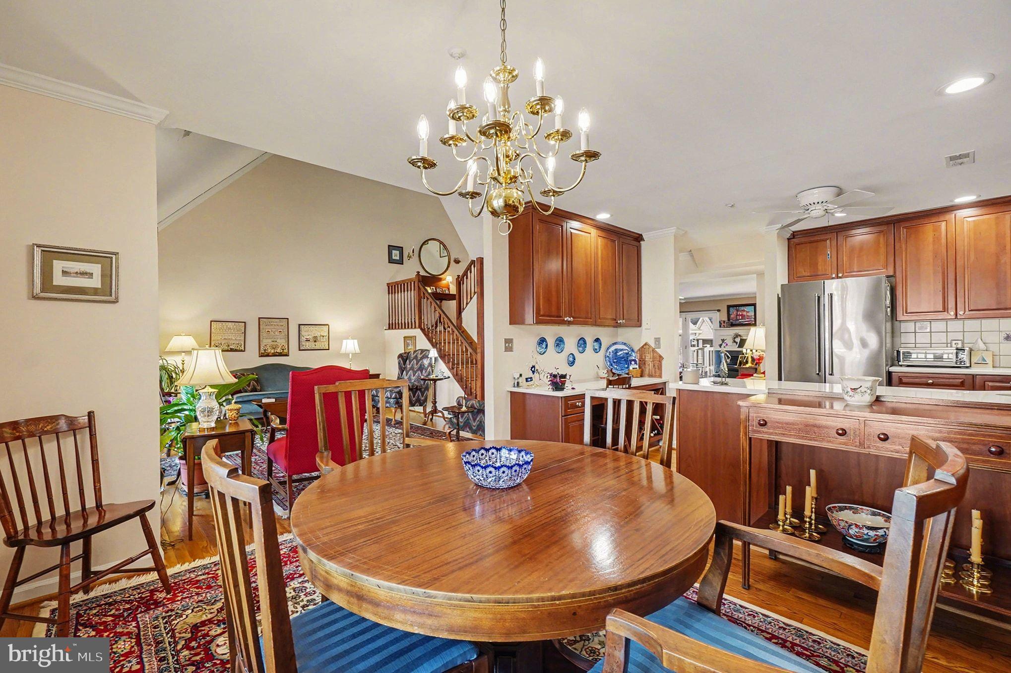 202 Pointe Way, Unit 202B Havre de Grace, MD 21078 - Photo 16 of 72 a dining room filled chandelier and wooden floor