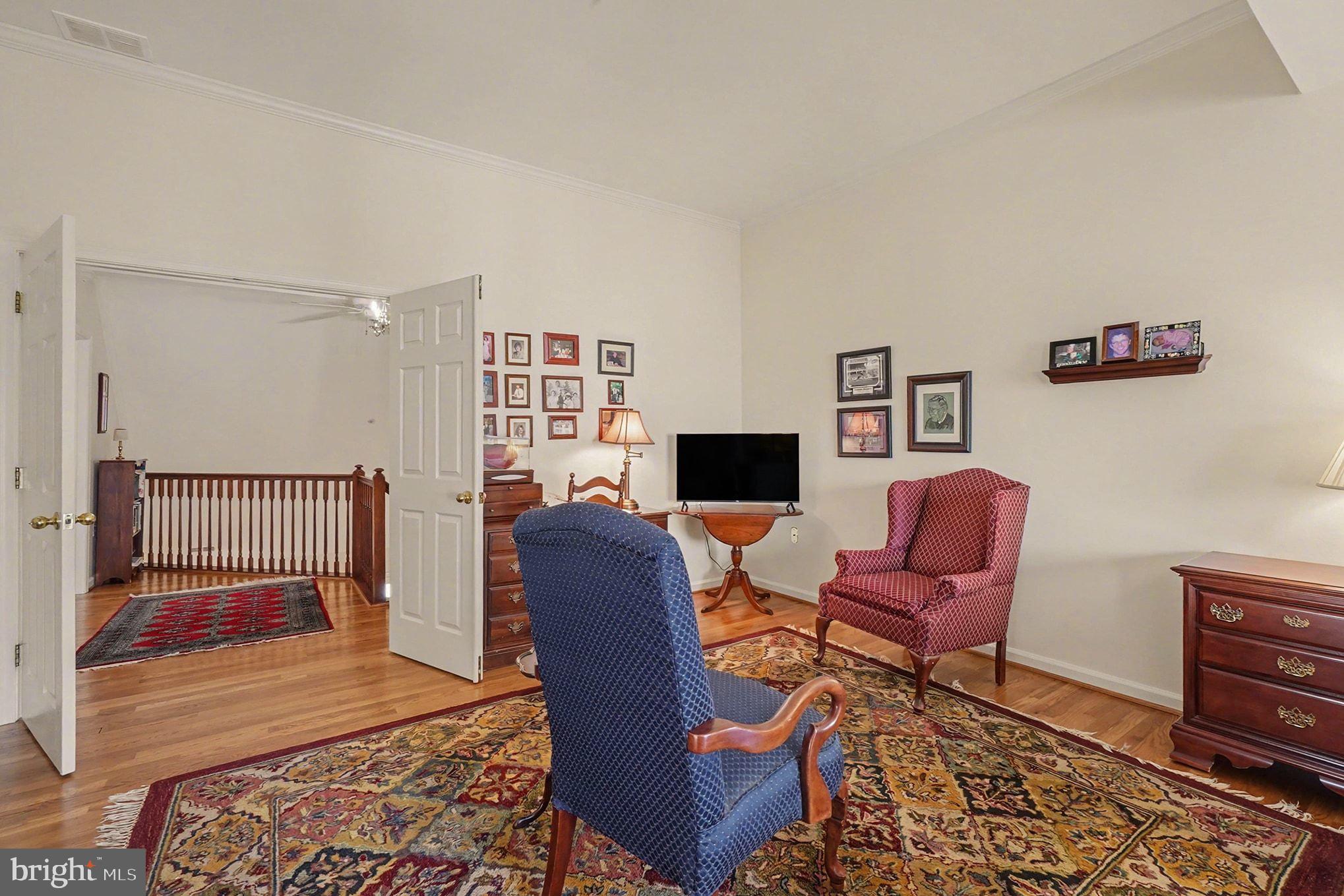 202 Pointe Way, Unit 202B Havre de Grace, MD 21078 - Photo 28 of 72 a living room with furniture and a wooden floor