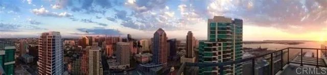 a bedroom with a large bed and a large window