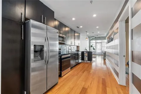 a kitchen with a stove microwave and sink